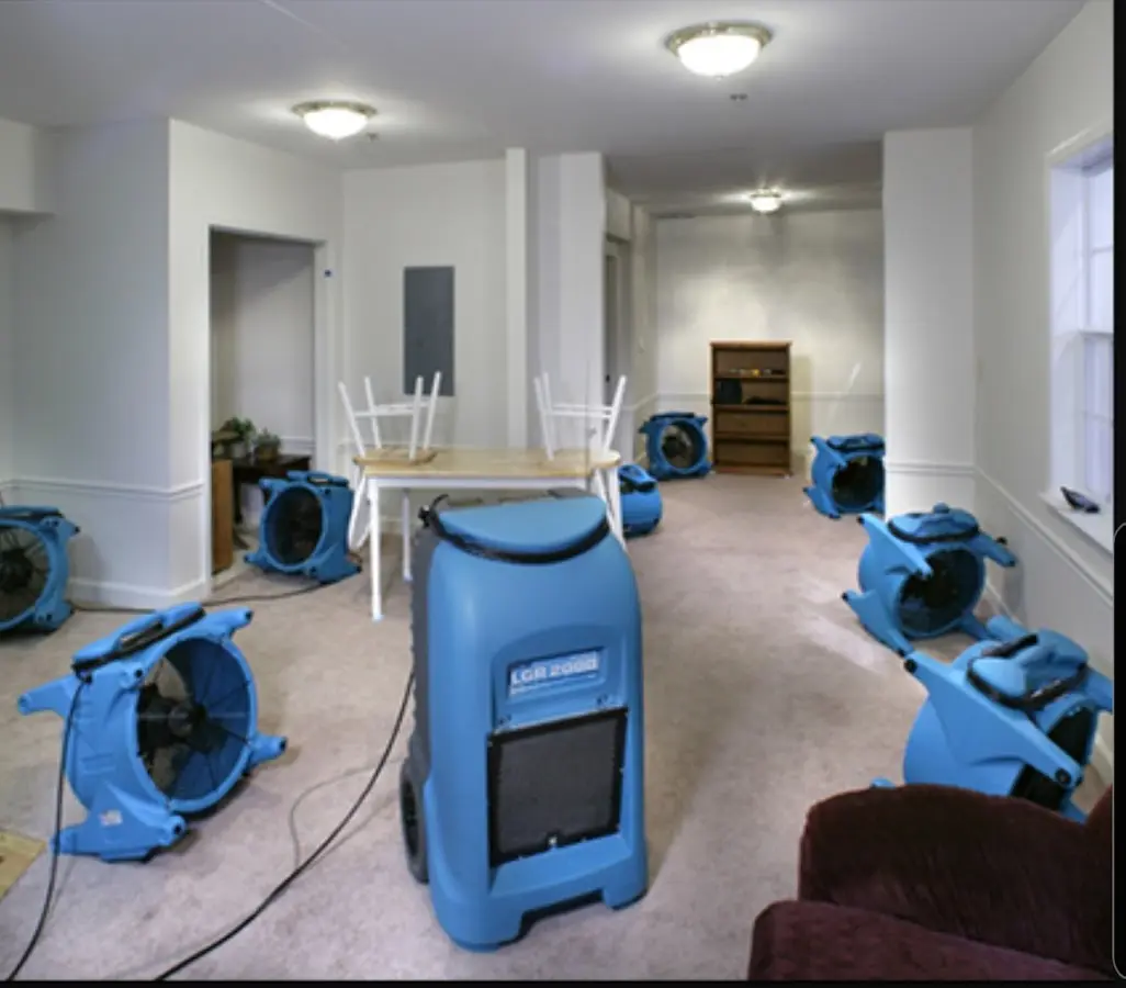 Air movers and dehumidifier setup for Water Damage Restoration in Owego